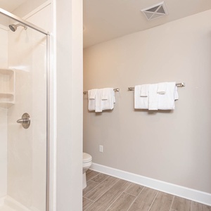Pamper yourself in this serene master bath, enjoying refreshing moments in the glass walk-in shower