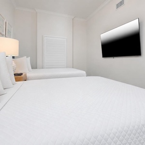 Unwind in this queen guest suite and stream your favorite shows or enjoy a good movie after a beach day