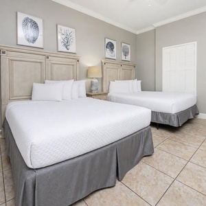 Relax on one of the cozy queen beds in this guest suite and enjoy a peaceful slumber