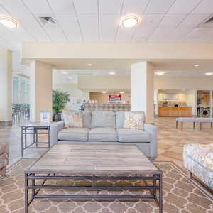 The welcoming lobby features a convenient from desk for check-in and a cozy seating area where guests can relax
