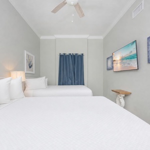 Unwind in this queen guest suite and stream your favorite shows or enjoy a good movie after a beach day