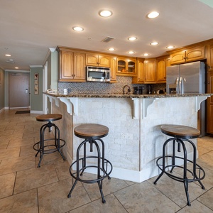 Gather around the stylish bar stools at the kitchen counter, perfect for casual meals and conversation