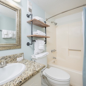 Refresh and rejuvenate in the guest bath, surrounded by plush towels and stylish decor to enhance your experience