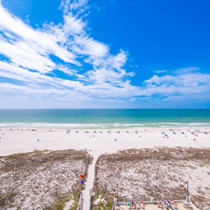 Breathe in fresh coastal air while soaking up vibrant views of beach life from your balcony