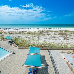 Experience the inviting gradual entry pool and vibrant splash park with beachfront views of the tranquil gulf