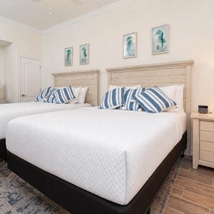 Recline on the two queen beds, feel the coastal vibe in the guest suite, and admire the seahorse and jellyfish art