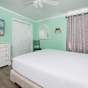 Mint walls surround you in the guest suite with a queen bed perfect for unwinding after an active day