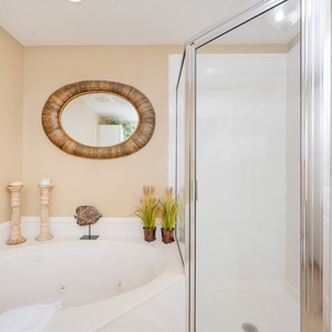 Refresh in the master bath after a day of adventure with a soothing jetted tub and relaxing walk-in shower