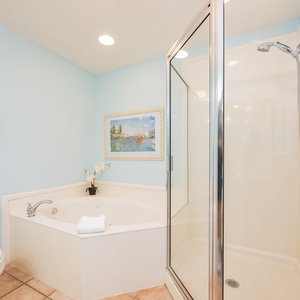 Indulge in relaxation in the master bath with a refreshing walk-in shower and soothing jetted tub