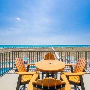 Savor refreshing cocktails at your table, soaking in stunning coastal views and the vibrant beach vibe from your balcony