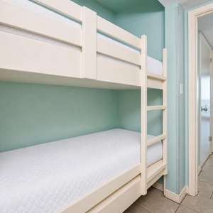 Bunk beds in the hallway offer a cozy spot for the kids after fun-filled days along the coast