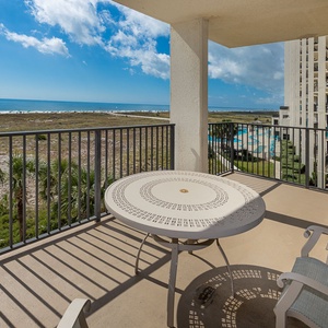 Balcony seating offers a tranquil spot to enjoy views of the beach and shimmering Gulf waters, perfect for relaxation