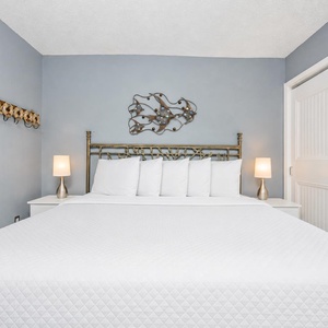 This serene bedroom features a plush king bed and soft lighting for a relaxing retreat