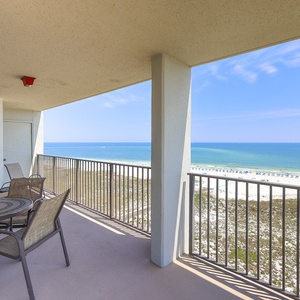 Balcony seating offers a relaxing spot to enjoy the expansive gulf view and white sand beach below