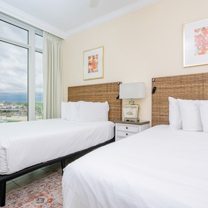 Relax on one of the cozy queen beds in this guest suite and enjoy a peaceful slumber with stunning views