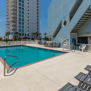 Relax by the refreshing pool with a lovely view, perfect for unwinding after a day of adventure at Summer House West