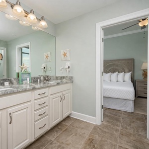 Freshen up in this guest bath in the relaxing shower or soothing tub before an exciting beach day