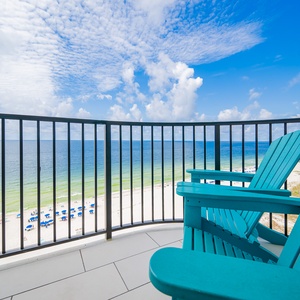 Relax in the turquoise chairs on your balcony, enjoying panoramic views of the beach and tranquil waters