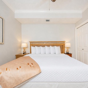 Drift into sweet slumber on the king bed in the guest suite, where soft bedding and coastal accents create a restful retreat