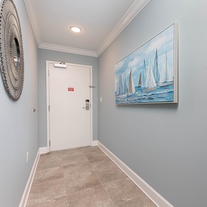 Step into this welcoming entryway, where coastal artwork sets a relaxing tone for your beach getaway