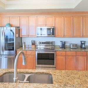 Whip up family favorites in the sleek kitchen, featuring stainless appliances and ample counter space for meal prep