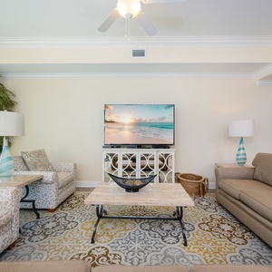 Unwind in the cozy living room, streaming shows on the TV while surrounded by soft, inviting furnishings
