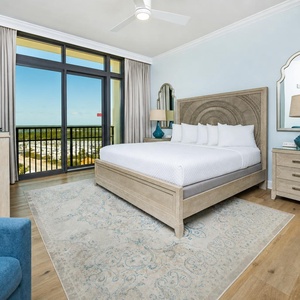 Experience tranquility in the king master suite, resting on plush bedding while enjoying serene views from the balcony