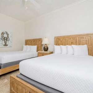 Sink into the soft bedding of this inviting guest room with queen beds, where restful nights prepare you for beach days