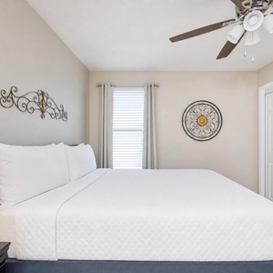 Drift into restful nights in this queen guest suite, with calming decor and gentle breezes inviting relaxation