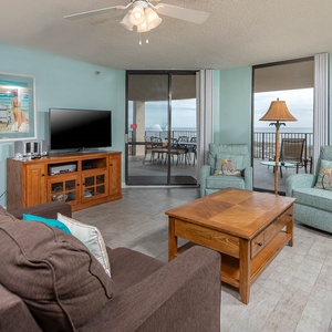 Unwind in the inviting living area, featuring a queen sofa sleeper and a view that beckons relaxation