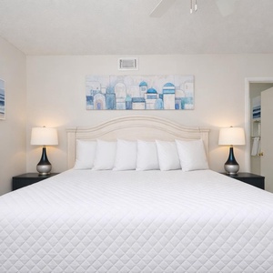 Drift into restful nights in this king guest suite, embracing the serene vibe and soft linens of your tranquil retreat