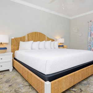 Inviting guest bedroom featuring a large king bed, soft linens, and cheerful decor for a relaxing stay