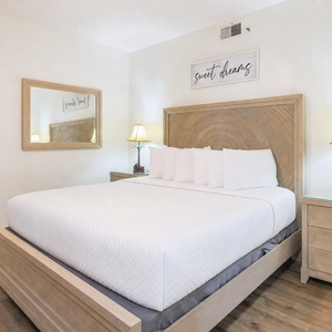 Drift into bliss on the plush king bed in the guest suite, embraced by soft pillows and serene vibes