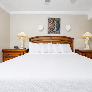 Master bedroom with a plush king bed, coastal decor, and soothing colors for a restful night's sleep
