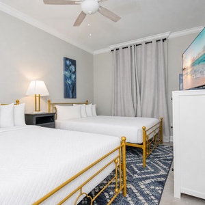 Unwind in this queen guest suite and stream your favorite shows or enjoy a good movie after a beach day