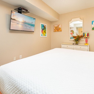 Rest comfortably surrounded by cheerful decor, and stream your favorite shows on the TV in this king guest suite
