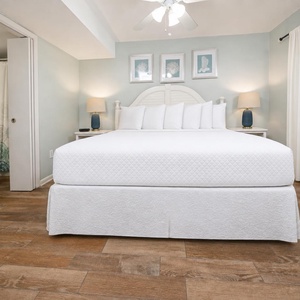 The master bedroom features a plush king bed, soft lighting, and a serene color palette for a restful retreat