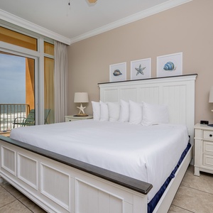 Retreat to the king master suite with cozy bedding and drift off to the sound of the waves from the balcony