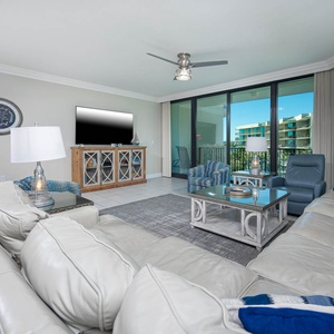 Unwind in this inviting family room with cozy seating and enjoy a movie or stream your favorite shows