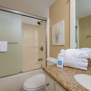 Relax and refresh in the guest bathroom, where soft towels and elegant touches enhance your rejuvenating experience