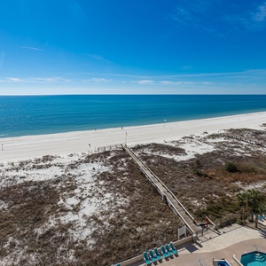 Gaze at the expansive shoreline and tranquil waters from your balcony, perfect for relaxation and enjoying the view
