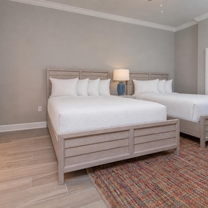 Sink into a fluffy queen bed, switch on the lamp, and rest peacefully in this guest suite