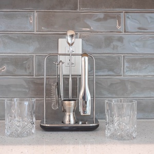 Use the polished bar tools and crystal glasses at the wet bar to mix and savor chilled drinks