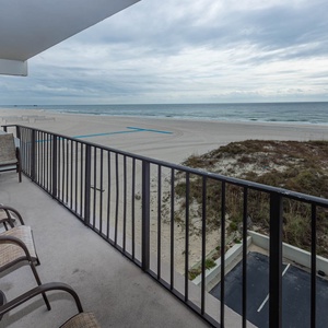 Enjoy stunning beachfront views from the private balcony, perfect for relaxing or entertaining with friends