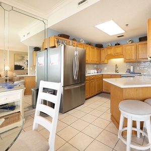 A bright kitchen welcomes you to prepare fresh meals while the dining area invites casual conversation