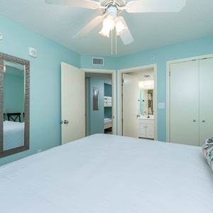 Unwind in this serene bedroom suite with a plush king bed, a wall-mounted TV, and en-suite bathroom