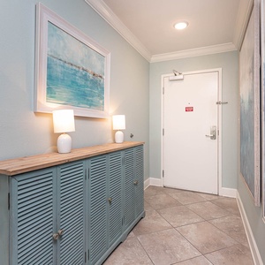 Step into a refreshing entryway, where calming art and soft lighting welcome you to unwind by the coast