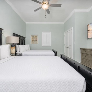 Unwind in the guest suite with two queens after a day at the beach with your favorite show
