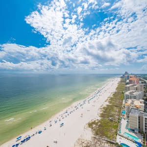 Gaze at the breathtaking beach views from the balcony, soaking in the vibrant colors and tranquil atmosphere