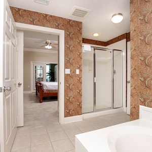 Indulge in relaxation in the master bath with a refreshing walk-in shower and soothing jetted tub